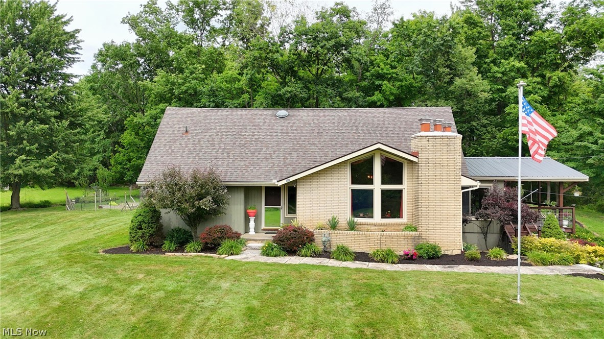This stunning Cape Cod estate, located at 8897 Hillcrest Drive, offers a private retreat on 3.8 wooded acres within the Westfield Center community. This property features over 3,250 finished square feet of living space, providing a perfect blend of privacy and convenience.
The exterior grounds are a highlight, featuring two ponds, one of which is stocked and dredged, an accessible island, and a new dock. Outdoor living is enhanced by a new gazebo, a thoughtful deck overhang with ceiling fan, and a patio with a built-in fire pit. A charming flagstone walkway leads to the front porch, and the property includes a shed for additional storage and a garden space for plant lovers.
Inside, you are greeted by a large entryway leading to a living room with vaulted ceilings, a gas fireplace, and oversized windows that provide picturesque views of the water. The eat-in kitchen is appointed with hardwood cabinets and granite countertops, complemented by a formal dining room. The main floor includes a full bathroom with a walk-in shower, a spacious laundry room, and a versatile office or bedroom. An additional living area is filled with natural light and features a wood-burning fireplace.
The upper level contains three large bedrooms, including a primary bedroom with wall-to-wall closet space and direct access to a full bathroom. In total, the home offers 4 bedrooms and 2 full bathrooms. The partially finished basement includes built-in features for a recreation room, while the unfinished portion provides a work bench and access to the two-car garage.
Additional features include:
Public utilities and no HOA fees.
A maintained boiler system with a new expansion tank and pressure release valves.
Location within the Cloverleaf Local School District.
Access to community amenities such as golf courses, a community lake, and tennis courts.
This home combines extensive acreage, water features, and updated amenities to create a unique living experience.