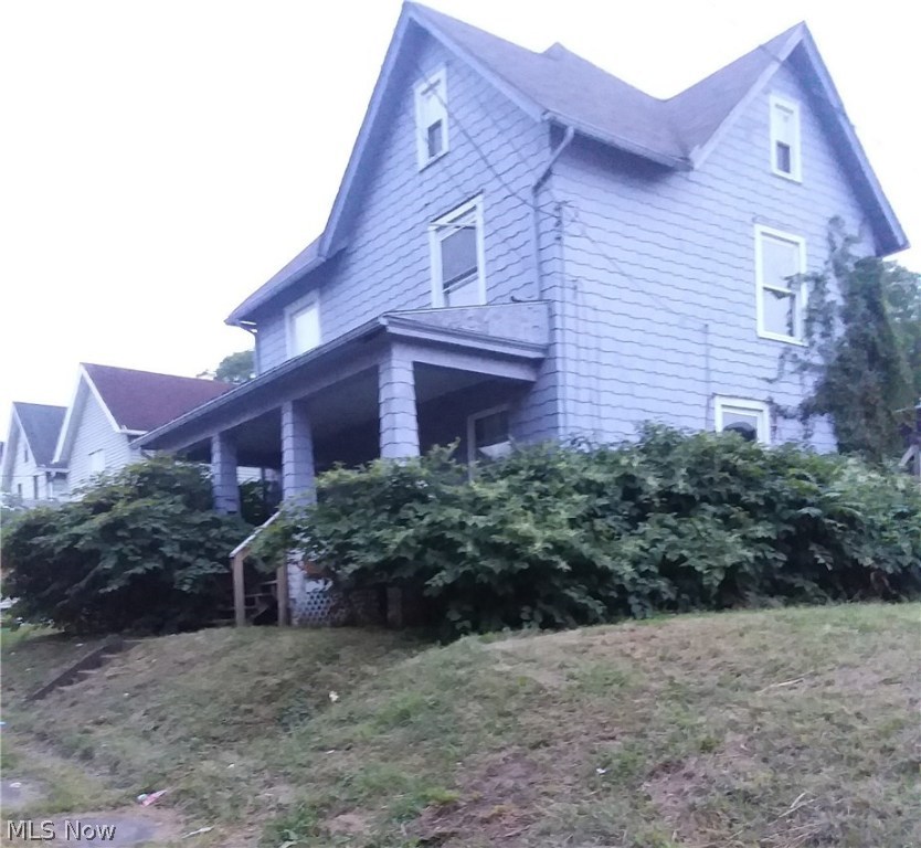 Large 3 bedroom two-story in need of some TLC. Newer windows. Convenient location.