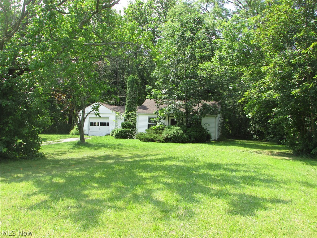 $20,000 PRICE REDUCTION!! 2.41 acres in Stow.  This excellent deep, wooded lot is 126x863 with public utilities.  The ranch home sitting on the property just needs a little TLC.  It has a newer roof.  Very nice outbuilding to the rear.