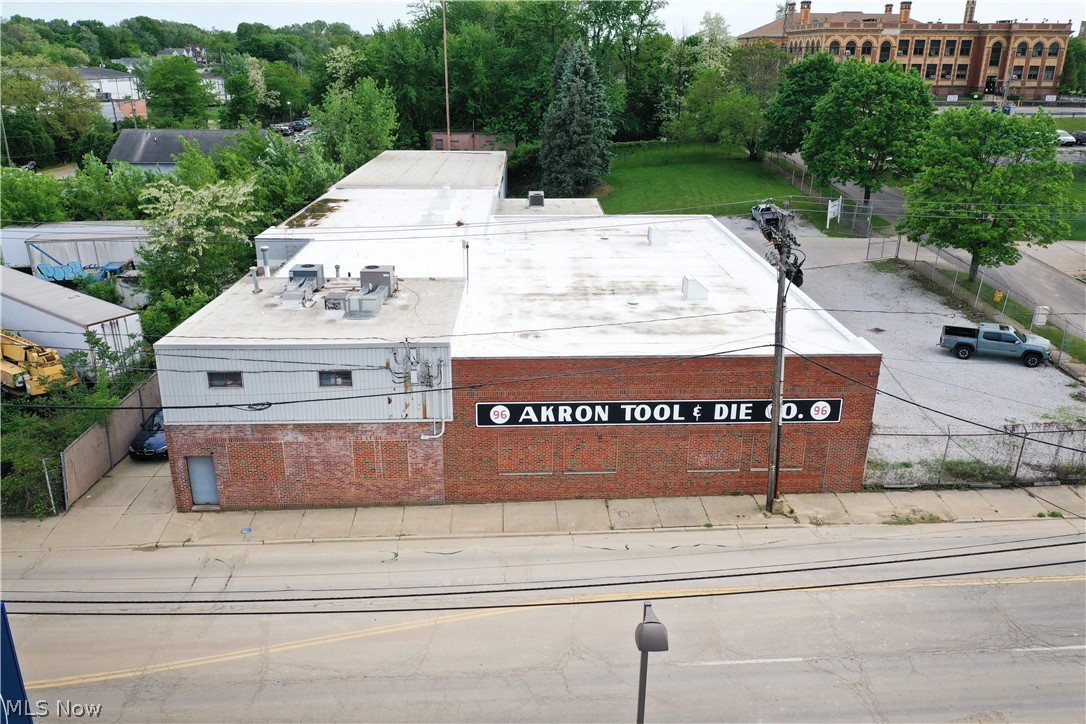 Located in downtown Akron on a corner lot. 21,000 sq. ft. industrial warehouse that was the global headquarters for a large Industrial Equipment Manufacture. Very clean! Building features both up and downstairs offices and conference room. Most industrial cranes will stay. New roof and new insulation, (2022). New natural gas heaters installed in the warehouse in (2022). Office space has HVAC heating and cooling. Three restrooms on site. Large, gated parking lot with security system. Extra space for parking expansion. 14’ Drive in door for easy delivery in and out deliveries. Plenty of power, 800 amps, 240v, 3 phase power.