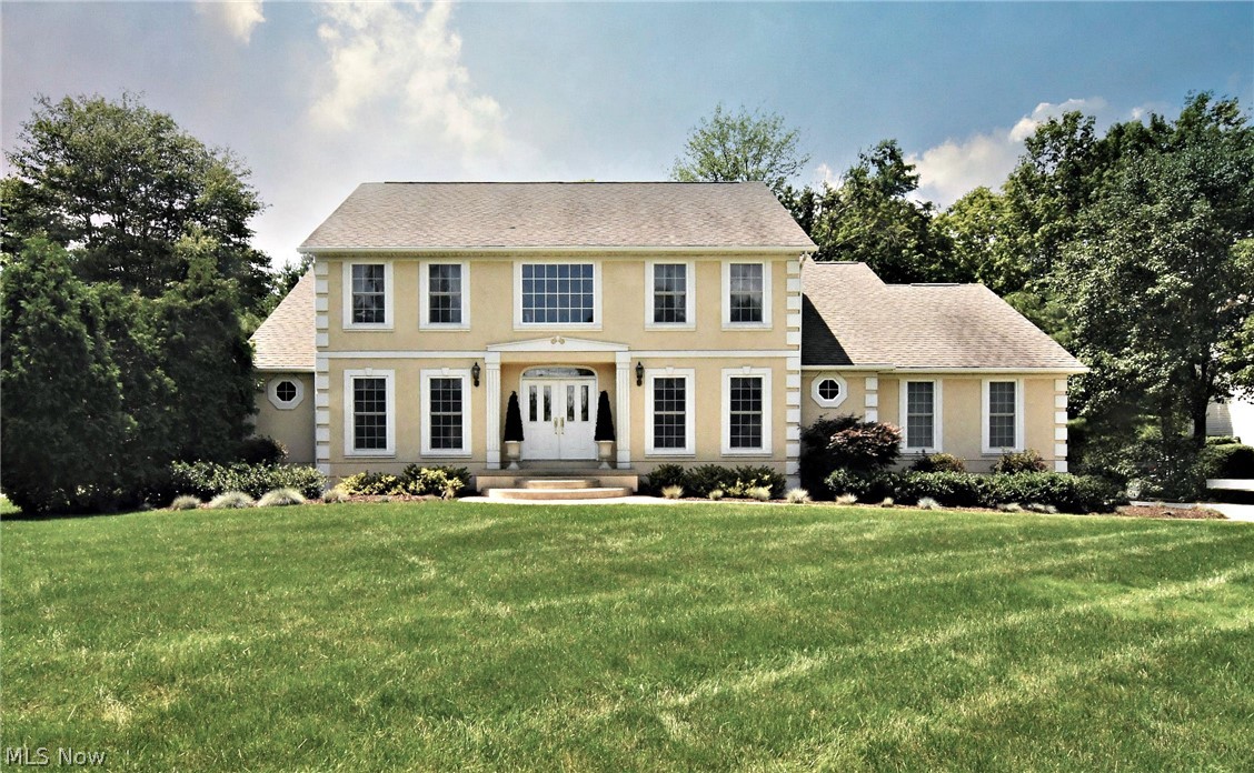 Here it is and ready to be SOLD. One owner, custom-built home in Ridge Crest Development. This home has had much TLC and offers a magnificent, efficient floor-plan and is beautifully decorated and maintained. There are 4 generous-sized bedrooms with the Owner's Suite on the main floor and offering 2 separate his and her master baths. There are a total of 3 full baths and 2 half baths. The entrance has an open foyer with a palladium window and grand staircase. Very well-appointed kitchen with a center island and large dinette eating area. Also, a family room with fireplace for family and friends to gather around. The lower level is a walkout and has a lot of windows for light. The lower level offers a 46x40 rec room and office for privacy. This home has much to offer. Call to preview today.