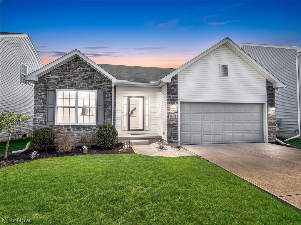 Welcome to this spectacular updated modern ranch with a full finished basement boasting nearly 3,000 square feet of finished living space and 3 full baths! TAX ABATEMENT in place through 2033—providing substantial tax savings and lower carrying costs. The vaulted ceiling in the great room opens seamlessly to the kitchen and dining area, creating an ideal layout for everyday living and entertaining. Gorgeous white cabinetry with granite countertops and a convenient bar-top overhang highlight the kitchen. First-floor laundry adds everyday convenience.

The spacious primary owner's suite features a private bath with walk-in shower and oversized walk-in closet.

The massive finished basement offers a fantastic recreation room and a private bedroom-style suite with closet and adjacent full bath — ideal for guests, in-law, or extended living, with potential to function as a 4th bedroom. Everything is freshly appointed with modern gray interior paint and brand-new carpeting.

The rear deck off the sliding doors of the dining area overlooks a lovely yard. Outstanding curb appeal with attractive stone front elevation and updated landscaping. This home shows like a newly built home in true move-in ready, turnkey condition in a fabulous location near all amenities!