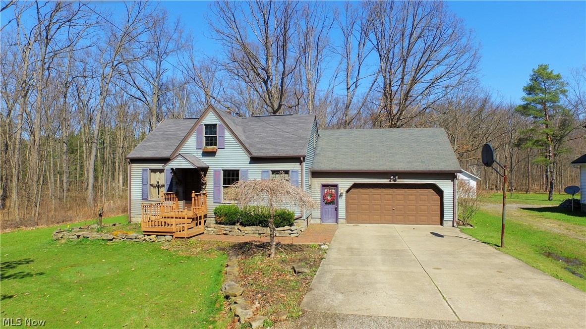 Cutest cape cod in Southington! This 2 bedroom home offers a stunning updated kitchen with tile mosaic backsplash, tons of cabinet space, and recessed lighting. Large living room with newer laminate flooring. Nicely sized dining room with large double door leading outside to the 17x16 deck overlooking the beautiful wooded backyard. First floor bedroom with a large closet. Huge master bedroom with stunning half moon window that lets in a ton of natural light. Full dry basement. Attached 2 car garage with opener and shed out back. Updates include: 200amp electric service, furnace 2013, hot water tank 2013, and brand new septic 2015.