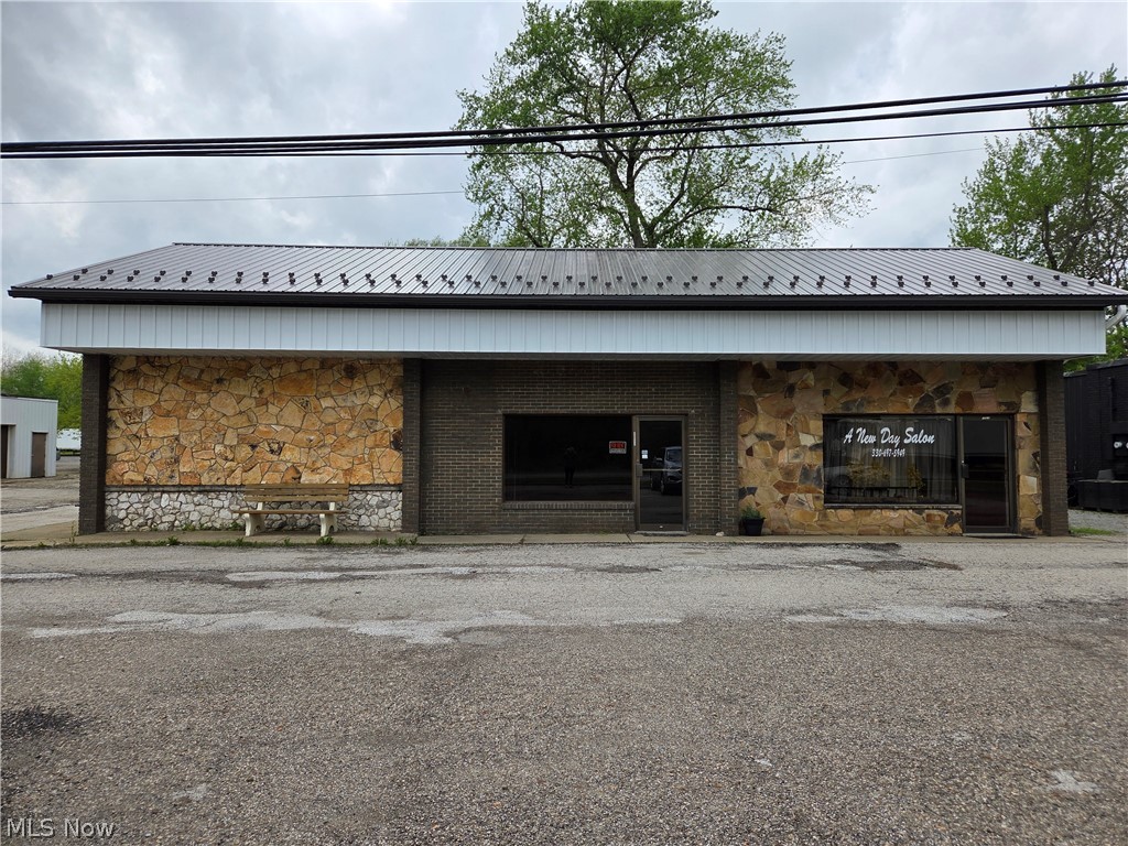 Great opportunity to bring your next business idea to life in this versatile commercial space for lease! Previously operated as a pizza shop and recently set up for food preparation, the space includes food-grade ceiling tiles, two large sink areas, and an exterior grease trap, making it well suited for restaurant, café, catering, or other food-related uses while still offering flexibility for many business concepts. Enter through a stylish wood-lined front room that creates a warm first impression, with a charming barn door leading into additional space that would make a great dining area, party room, or expanded workspace. The building features insulated block walls, a discreetly hidden electrical panel, and a convenient unisex bathroom. The landlord has recently completed major updates including a new roof, brand-new furnace, and new hot water heater for peace of mind. With two entrances and space to create a back patio overlooking the river, this property offers character, functionality, and the perfect canvas to launch or grow your next business venture.