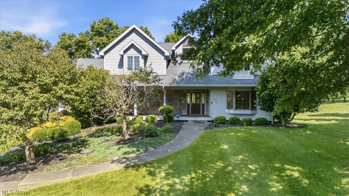 Nestled on 3 beautiful acres, this impressive 4 bedroom, 4.5 bath home offers the perfect blend of peaceful living and everyday convenience. From the moment you walk in, you'll be captivated by the soaring ceilings, the open great room with a floor-to-ceiling stone fireplace and expansive windows showcasing the picturesque views. The thoughtfully designed floor plan offers plenty of space for family to unwind or entertaining your friends. The first floor features a beautiful entryway, great room, spacious eat-in kitchen, breakfast nook, master suite, laundry room and a half bath. Upstairs you'll love the open view of the first floor as you make your way to 2 bedrooms sharing a bathroom, and an additional bedroom with its own private full bath. The walkout basement gives you more space with a family room, bedroom/office, full bath and unfinished storage space. Incredible bones, architectural character and an opportunity for you to update to your personal style. Don't miss this one of a kind property, located in the wonderful Windsor Estates!