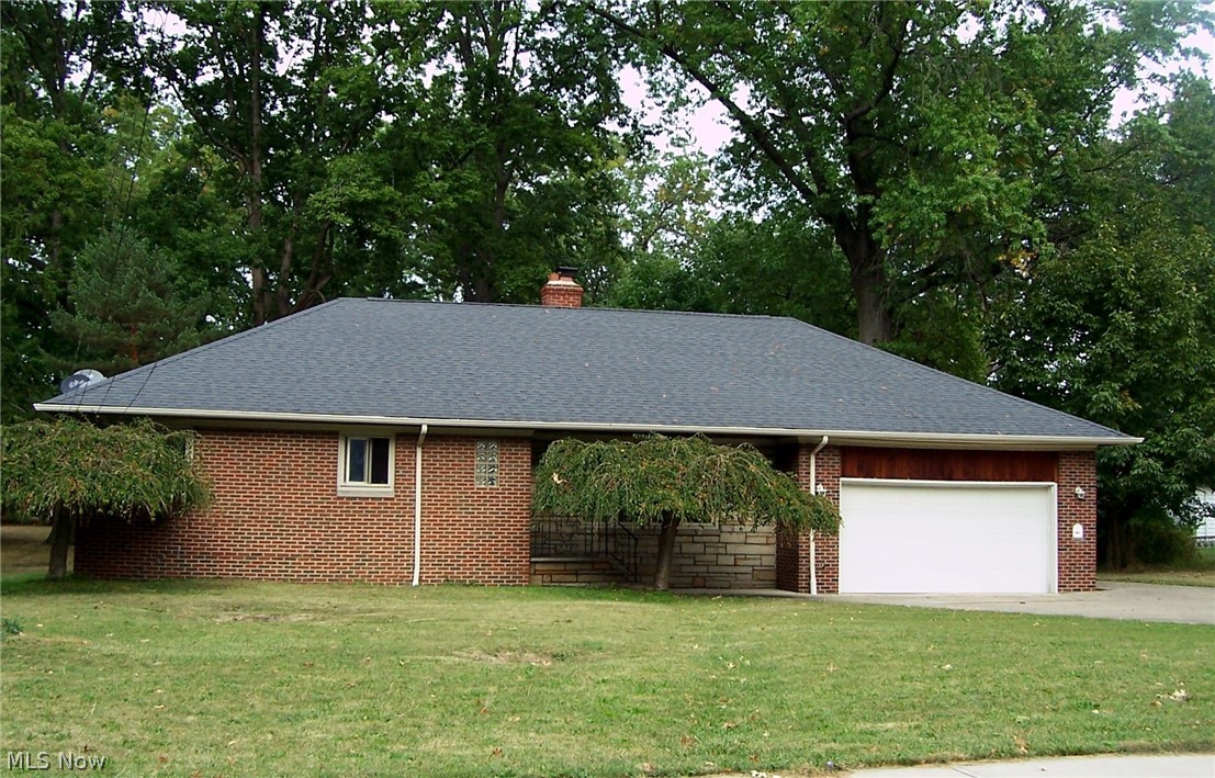 Sprawling Ranch on Lloyd Road with .53 acre lot! Two car attached garage and another two car garage with electric is in the back yard! Large eat-in kitchen with new laminate flooring.  One and one half baths. Sunroom off dining room also has new laminate flooring. Hardwood in living room, dining room and all three bedrooms can be refinished.  Fireplace needs inspected to see if can be operational.  Come and put your finishing touches on this home with such wonderful potential.