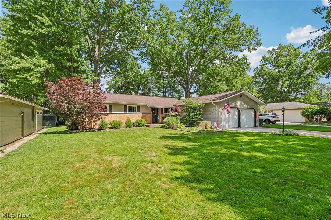 Situated on a beautiful .29-acre lot, this meticulously maintained 3 Bedroom, 2.5 Bath Ranch home offers many amenities and the perfect blend of indoor comfort and outdoor style. Step inside through the inviting entrance foyer and you’ll be greeted by the spacious Dining Room with gleaming wood floors that also flow through most of the main level living areas. The spacious kitchen offers lots of counter and cabinet space, a built-in desk, breadbox, and all appliances (included). The Family Room is highlighted by a wood-burning fireplace with gas starter and marble surround, an entertainment surround sound system, and wood French doors to the adjacent 4-season room. The beautiful 4-season room features plenty of windows to open on nice days to enjoy the fresh air and doors leading to the outdoor patio. The adjacent outdoor patio is covered by a vaulted Pergola with ceiling fan and is a great place to host outdoor barbeques or just relax and enjoy the views. The main living areas offer 3 Bedrooms with hardwood floors, ceiling fans, and one with his/her closets. The main bathroom is all newly renovated with a separate spa tub and walk-in shower with glass doors. The main bath also features dual sinks and tile surround. The first floor also features an additional half bath just off the mudroom via entry from the attached garage. The home offers even more living area in the newly finished basement offering plenty of space for a home gym, theater, or playroom. The finished area is fully carpeted, has recessed lighting, and extra storage cabinets. The basement also features a finished Bonus Room that can be used as an office, extra bedroom, or storage space. In addition, you’ll enjoy the convenience of another bathroom and shower. The beautifully landscaped backyard provides a peaceful outdoor retreat and a large storage shed. Newer H2O tank (2025). Roof (10 years). Light neutral décor throughout. One year America’s Preferred Home Warranty included.