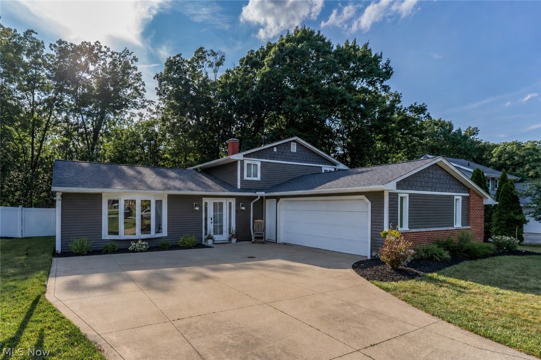 Welcome to this beautifully updated split-level home situated on a fantastic private, wooded lot in Strongsville. All the hard work has already been completed, making this a truly turnkey property. Inside, you will find all-new flooring, fresh paint throughout, and a completely renovated kitchen with soft-close shaker cabinetry and new appliances. A huge pantry, coffee bar, and beverage center provide additional storage and functionality while making the space ideal for everyday living and entertaining.The lower-level living area is warm and inviting, highlighted by a fireplace that creates the perfect space to relax or gather with family and friends. The home offers three spacious bedrooms and a large full bathroom featuring a double vanity. Additional half bath for added functionality. The fenced-in backyard provides plenty of room to enjoy the peaceful wooded backdrop. Major exterior improvements include new siding, roof, gutters, and soffits, all completed in 2022, along with a new bay window installed in 2025. This home has been thoughtfully improved from top to bottom and offers tremendous value. You truly must see it in person to appreciate everything it has to offer.