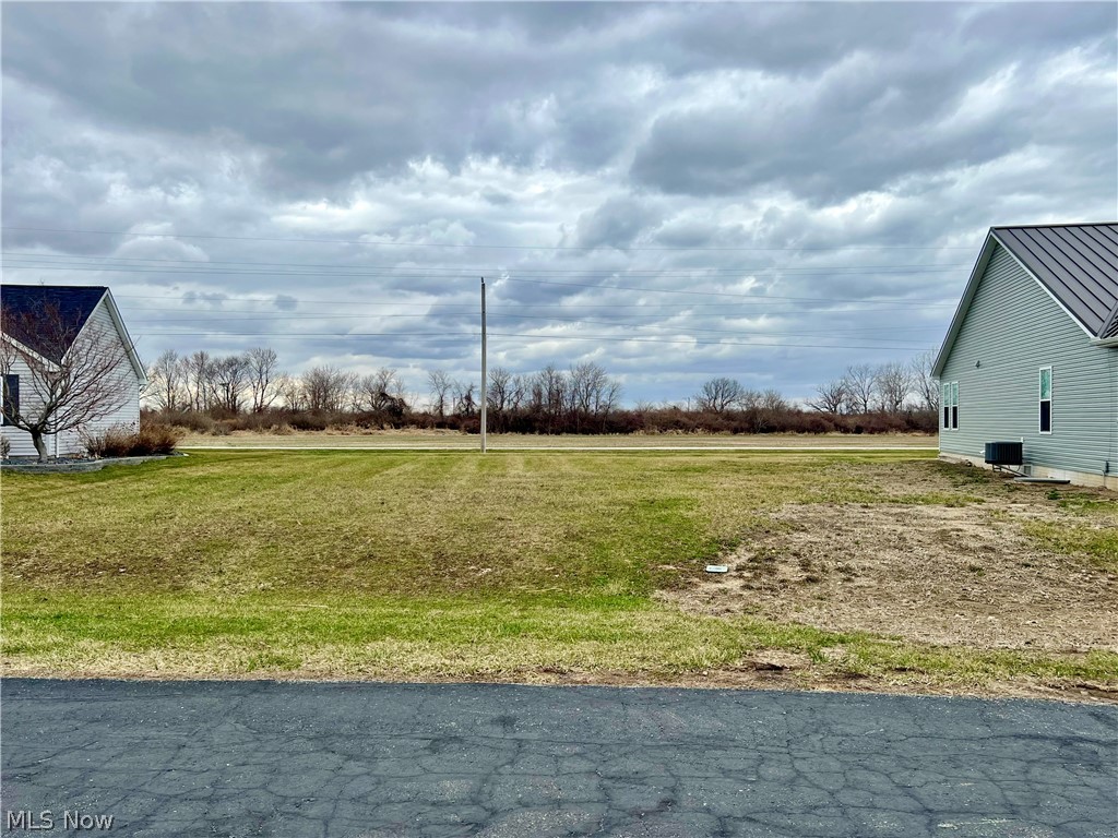 Bring your own Builder to this amazing opportunity on a cleared and improved lot in the highly sought-after Cove on the Bay gated waterfront community! Enjoy the Bay with views from a private marina right at the end of the street, the covered picnic area, private beach, or while relaxing with a community campfire. Cedar Point thrills are also just across the water! Homeowners Association has exclusive rights to use the Marina, and dockage is for sale through the Developer. Property comes with very lenient architectural restrictions for your future home with the opportunity for a pull-through garage and is located in the Danbury School District. Homeowner's Association Fee includes refuse removal and all public utilities are available at the street. Please note the property is owned by a licensed Ohio Real Estate Agent.