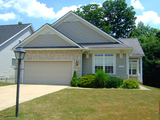 Welcome home to Ohio’s premier 55+ community, Greenbriar at River Valley! This ranch style cluster boasts a wonderful floor plan, neutral décor throughout, lots of natural light & beaut. wooded views. Greet your guests in the inviting entry w gorgeous hardwd floors. The entry is flanked by a spacious living rm w tray ceilings & crown molding & a spacious formal dining rm. Perfect for entertaining! The eat-in kit. is open to the fam. rm. This concept is sure to please. There are plenty of cabinets & loads of prep space! All appliances stay! The family rm boasts a gas fireplace w beautiful custom built-ins. There is a slider that leads to the fabulous deck where you can enjoy spectacular views. Retire to the spacious master suite complete w private master bath & large walk in closet.  There are 2 more bedrms another full bath & a convenient laundry rm that complete the main level. The full walk out basement has potential to offer almost 1800 additional sq ft of living space if finished.