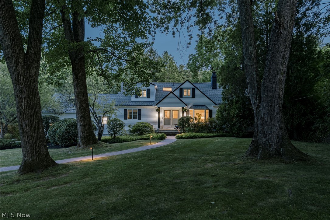 A rare 3-acre luxury property tucked away along one of the most coveted stretches of Jackson Road. This Moreland Hills retreat is just minutes from downtown Chagrin Falls. Surrounded by lush gardens, mature trees, and thoughtfully placed lighting, the property offers exceptional privacy.

Inside, abundant natural light and picturesque views connect the home to its beautiful surroundings. The dining room features a see-through fireplace, a sun-filled bay window, and wide-plank flooring. The adjoining office/family room offers vaulted ceilings, custom built-ins, a second fireplace, and garden views, creating a versatile space for work, relaxation, or gathering.

The great room showcases a vaulted wood ceiling, a raised-hearth brick fireplace, and walls of windows that bring the outdoors in. A wet bar connects the dining room and great room, while the adjacent dining area opens to an expansive deck overlooking the grounds. The large kitchen offers an abundance of cabinetry and a generous casual dining area, providing a more relaxed setting for everyday meals.

The first-floor primary suite offers privacy, a walk-in closet, and an ensuite bath with dual vanities and heated floors. Upstairs, two additional bedrooms share a skylit full bath.

The finished lower level offers exceptional flexibility with a rec room, laundry area, dog wash station, and an additional room ideal as a home office, fitness room, or additional living space. Outdoors, expansive decks, a screened gazebo, new custom stone hardscaping, and a fire pit create multiple places to entertain, unwind, and enjoy the private surroundings. A newly constructed outbuilding provides valuable storage or potential third-car garage space.

Private and distinctive, this beautiful property is best appreciated in person.