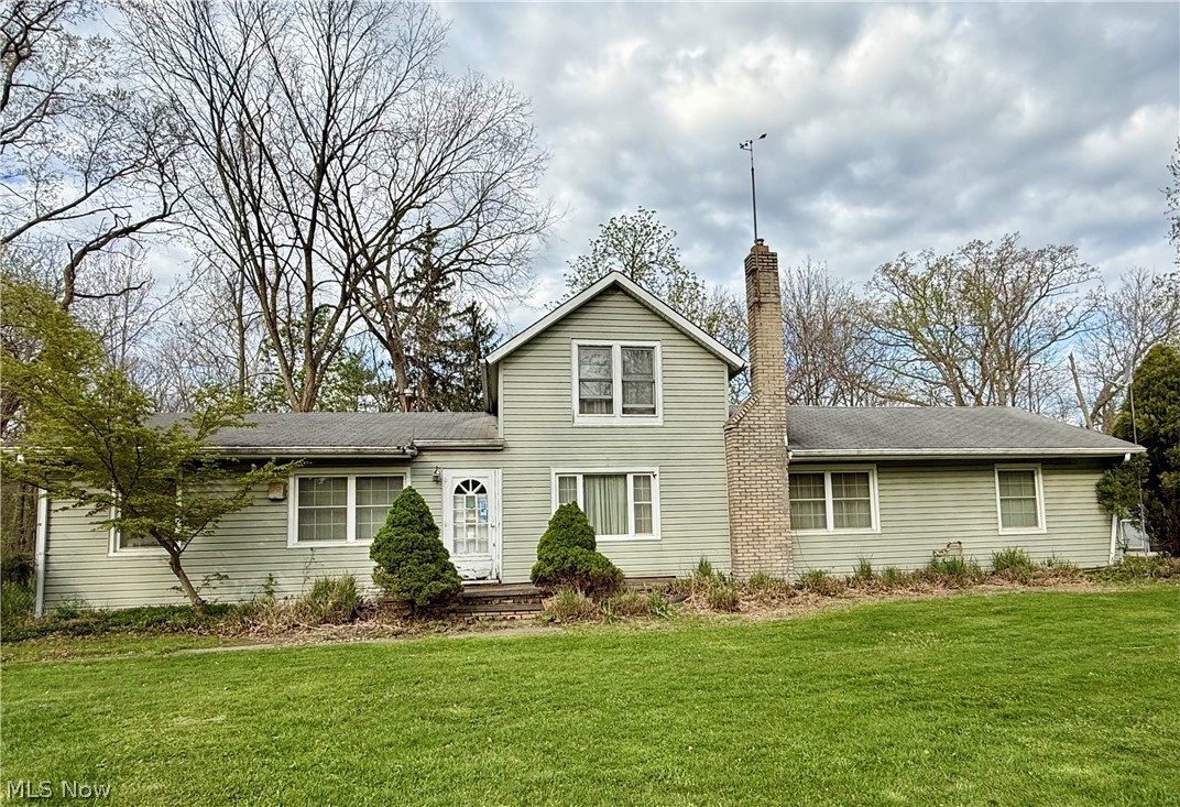14.52-acre investment opportunity offering significant upside for the right buyer. The parcel is split into two sections connected by an easement, with the front portion housing the residence and the rear portion comprising the majority of the acreage. The back section features a cleared area, large pond, wooded terrain, and borders Lorain County Metro Parks.

The home includes 3 bedrooms, 2 full bathrooms on the main level, and a flexible office/den space. Main living areas include kitchen, dining room, living room, and sitting room. A second kitchen was added and currently houses the laundry area, all on the main floor.

Additional features include a 2-car detached garage with a dedicated woodshop area and two patio spaces, one of which is fenced in.

Mechanical updates include HVAC approximately 5 years old. Living room has a gas fireplace (seller has not used; condition unknown).

Property is in need of updates and is being sold as-is. Strong potential for renovation, rental, or long-term hold. Ideal for investors, flippers, or buyers seeking acreage with value-added opportunity.