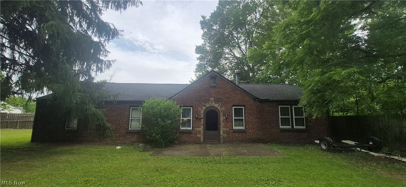 Spacious Brick Ranch on a double lot * Fenced yard * 3 Bedrooms, 1-1/2 Baths, & an Office (could be another Bedroom, but doesn't have a closet) * Eat in Kitchen with a huge walk-in pantry * Appliances included * Living Room has a wood burning stove * Above ground pool * Sump pump and HWT are approx. 5 yrs. old * Updated roof (on house) complete tear off (10-15 yrs.) and updated gutters * 2 car garage with vinyl siding * Private patio area * Laundry Room (floor access to the Basement) * Needs work and remodeling to bring this home back to life !