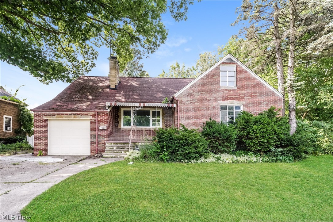Welcome to 1709 W. 22nd Street in Lorain—a spacious brick Cape Cod offering room to grow, entertain, and make lasting memories. Nestled on an oversized lot with a peaceful, park-like backyard, this unique property combines timeless character with exceptional versatility.