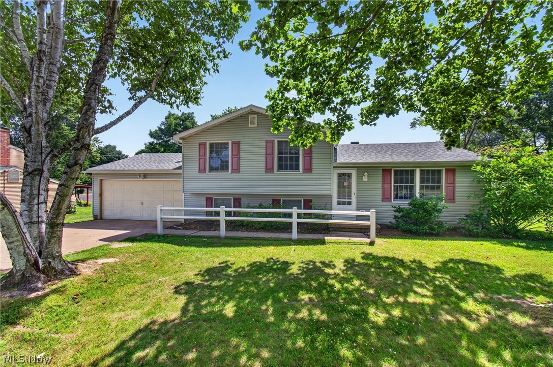 Welcome home to this beautifully updated three bedroom split level in Norton schools offering the perfect blend of style, comfort, and functionality. The inviting floor plan features a spacious living area that flows seamlessly into the updated kitchen, complete with elegant granite countertops, high end cabinetry, and ample workspace for cooking and entertaining. The home’s thoughtful layout provides comfortable living spaces while maintaining privacy between levels. Relax after a long day in the three season's room. The basement holds additional sq footage with a large rec room with wood burning fireplace, half bathroom, laundry area and plenty of storage. Outside, enjoy a fully fenced backyard with shed, ideal for pets, play, or outdoor gatherings. A two car attached garage with service door offers convenience and storage. Additional updates include; roof (5 years), well pressure tank and hot water tank (2025), significant tree removal, vinyl replacement windows, softener system and more. With quality updates throughout and move-in-ready appeal, this home is an excellent opportunity for buyers seeking modern finishes and everyday comfort.