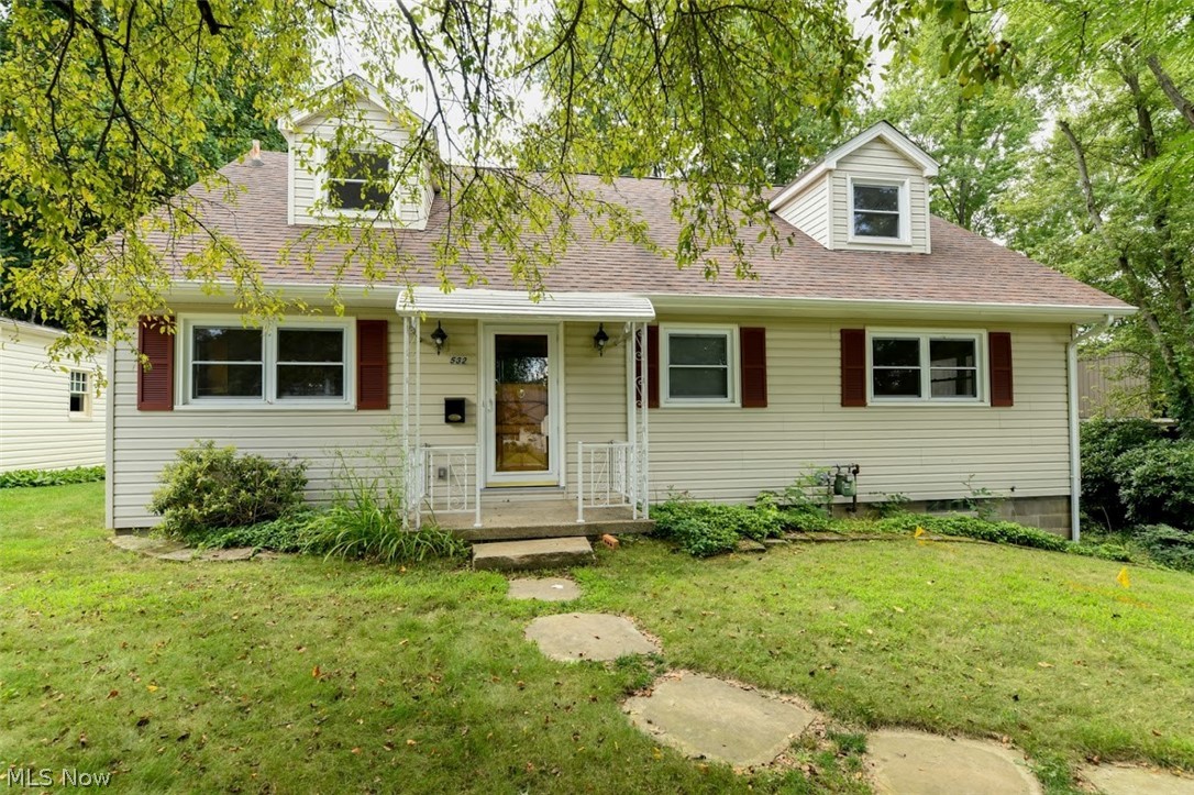 Welcome home to this 4 bedroom, 2.5 bathroom home with three season sun room and a bonus room in the basement! Enjoy a spacious great room with wood burning fire place and gorgeous built-ins. There is a first floor bedroom with 2 large closets! The open and bright, fully applianced, kitchen has 2 wall ovens and solid surface counter tops. The formal dining is open to the living room and also leads to the three season sun room. The second floor has 3  bedrooms all with gorgeous hardwood flooring, tons of storage and an updated second full bath. Newer windows throughout provide plenty of natural light.  The divided, walk-out basement also includes a partially finished bonus room (Perfect for home gym, possible office or family!). Outside there is a patio and a fully fenced large private back yard. Easy walking distance to Kent State campus, movie theaters, grocery stores, restaurants and more! Schedule your showing today!!