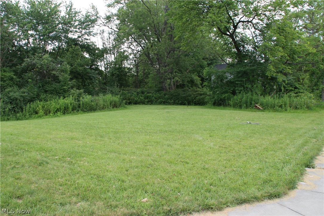 Three Flat Lots available at $15,000 each.  Or purchase as one large lot for a great home with land.  Energetic seller willing to negotiate! Great building and investment opportunity! The corner lot is flat, all utilities are at the street.  Apron for driveway is on Oxford St. You can start building right away. 125 x 120 lot if you purchase all three! Convenient location to shopping, freeways, and restaurants. Park & Playground in subdivision. Twinsburg Schools Rated Excellent!