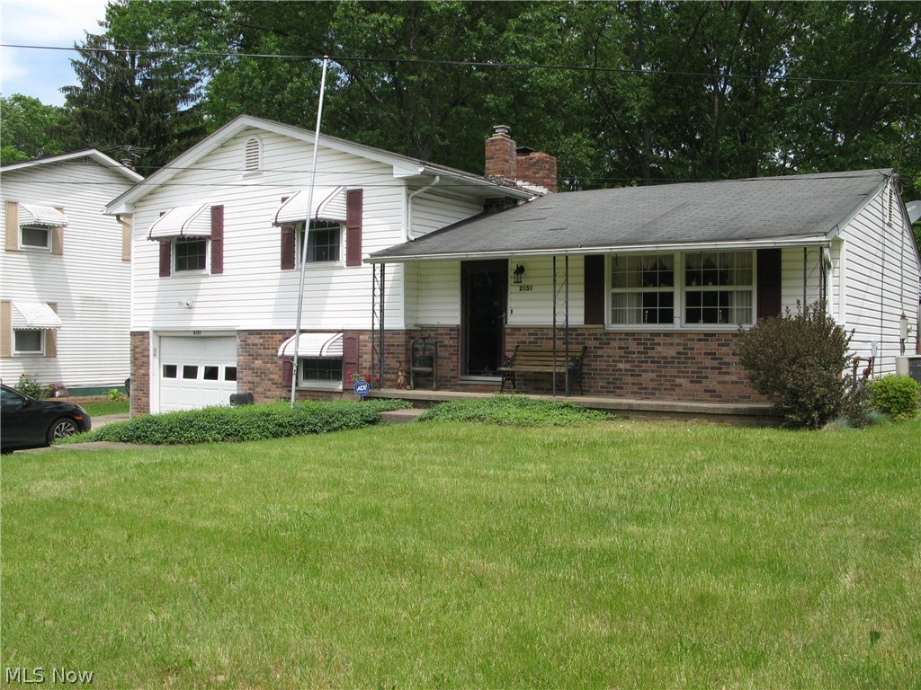 Tons of potential!  Nearly a 1/2 acre lot!  Bring your HGTV mindset, roll up your sleeves and get ready to bring this 3 bedroom split back to its former glory.  Attached one car garage with a nice adjoining workroom.  The additional detached 31 x 23 garage could be a "gearheads" dream or an amazing work space.  Partial fenced in yard.