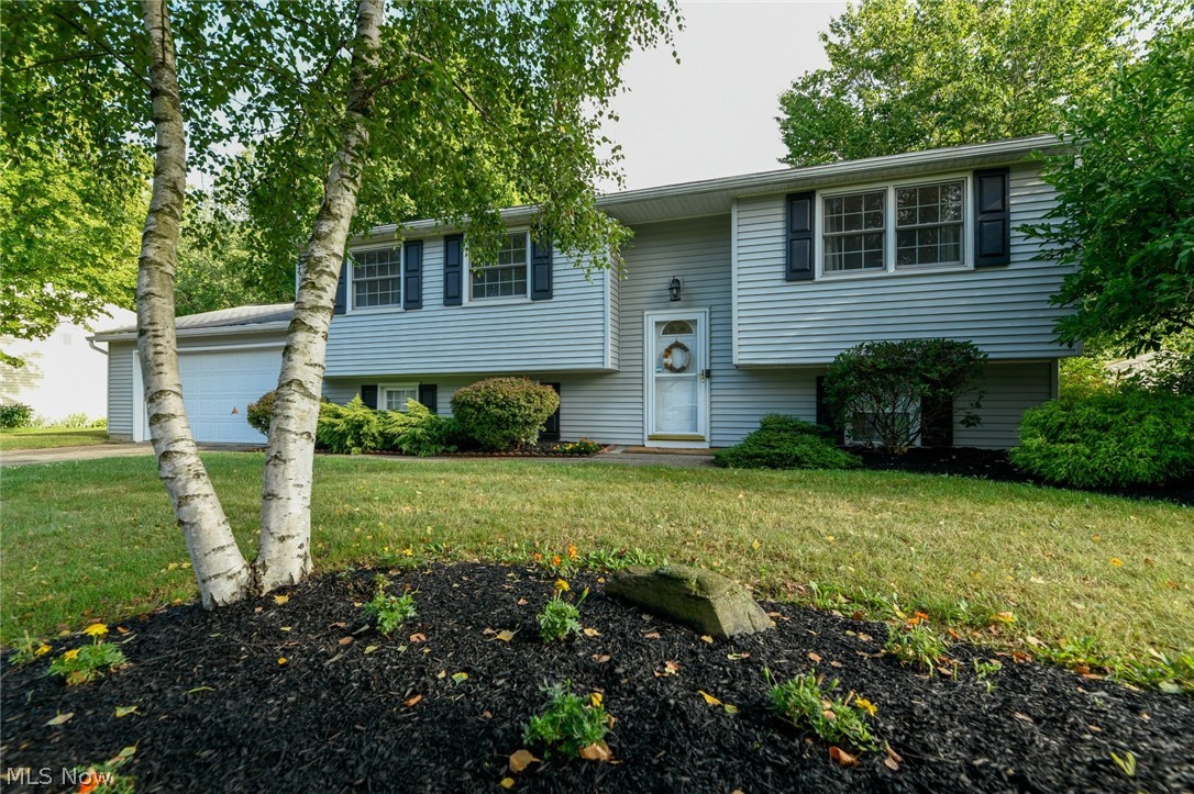This adorable, Stow home is the one you’ve been watching and waiting for!
Its bilevel floor plan features TWO large family rooms, 3 bedrooms, a dining room, and a  kitchen boasting of stainless appliances and granite. 
Entertain on your back deck while overlooking your nearly half acre yard! In addition to the 2 car garage, and in-home basement workshop, the backyard includes an oversized shed with a storage loft! This home can’t wait for you to call it yours.