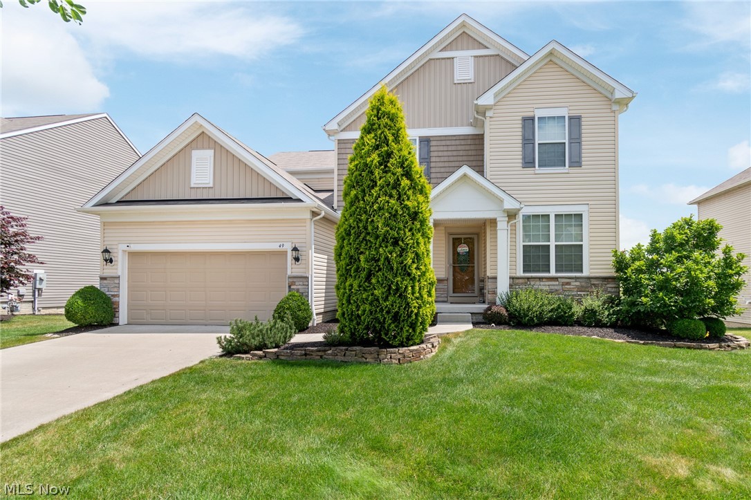 NOW... Look at This!!! 4BR, 2.5 bath beauty Located in The Preserve at Millers Farm. Revere Schools. The chef's kitchen features two-tone cabinetry, granite countertops with a built-in planning center, stainless steel appliances, a 5-burner gas cooktop, and a built-in convection oven. The main level offers a striking stone fireplace, wrought-iron stair railings, wainscoting, and a functional mudroom. Upstairs, you'll find a versatile loft, an updated primary suite with a quartz vanity, and three additional spacious bedrooms—each with its own walk-in closet. The basement is filled with natural light from daylight windows, is plumbed for an additional full bath, and offers endless potential for future living space. Step outside to the TimberTech composite deck with built-in lighting overlooking the professionally landscaped yard with a Rain Bird sprinkler system. Additional features include a Lennox furnace, Hunter Douglas blinds, ceiling fans throughout, a security system, a Level 2 Grizzl-E EV charger, and a tandem third garage bay for extra parking, storage, or workspace. This home offers the perfect blend of thoughtful upgrades, modern functionality, and room to grow.