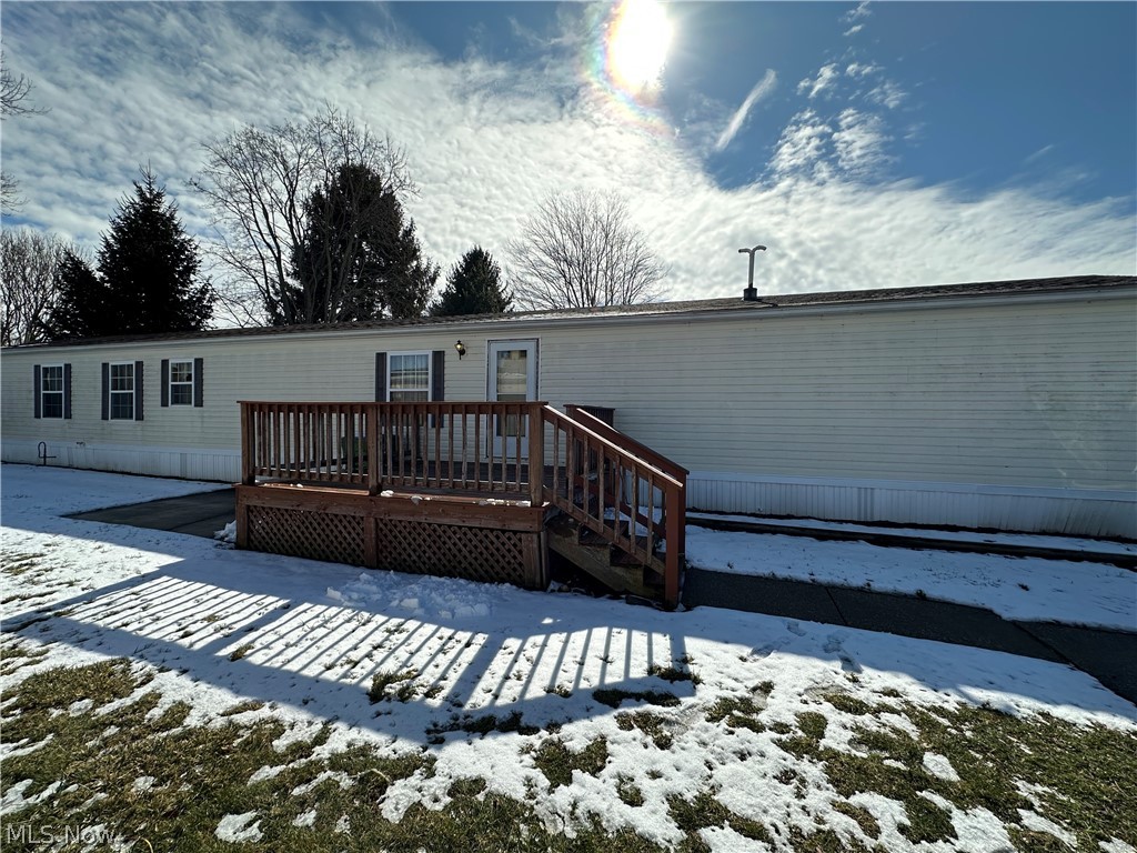 Welcome to 2655 Stoneyridge Drive in Madison 44057 — a warm and inviting home that has been lovingly cared for by the same family for over 20 years. This well-maintained 3-bedroom, 2 full bathroom mobile home offers comfortable living with a bright, open feel throughout. Large windows fill the space with natural light, creating a cheerful atmosphere in every room. The spacious kitchen provides ample cabinet and counter space, making meal prep and gatherings easy and enjoyable. Just off the kitchen, a dedicated dining area offers the perfect spot for family dinners or entertaining guests. The primary suite features a private ensuite bathroom complete with both a soaking tub and separate shower — your own relaxing retreat at the end of the day. Two additional bedrooms and a second full bathroom provide flexibility for family, guests, or a home office. Step outside to enjoy the deck, ideal for morning coffee or summer evenings, along with two concrete patio areas for additional seating or outdoor activities. A convenient side-door exit adds functionality, and the home includes two available parking spaces. Being sold as-is, this home is full of potential and ready for its next chapter. With over two decades of cherished memories made here, it’s now ready for a new owner to make it their own.