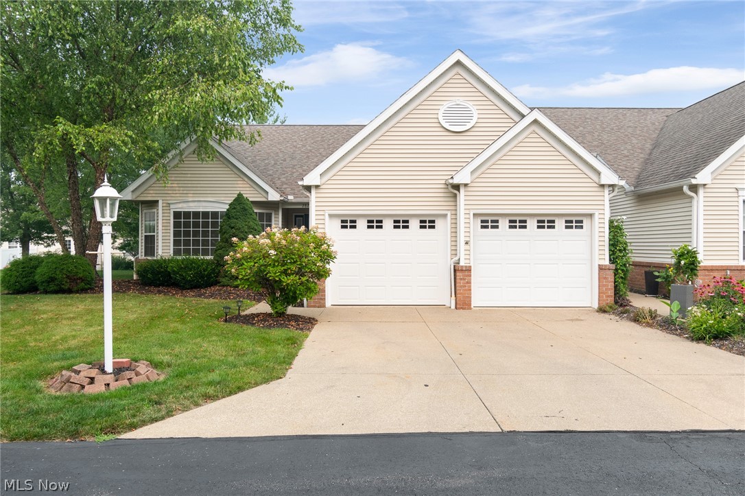 Welcome home to this beautifully updated, move-in-ready 2-bedroom, 2-bathroom home in the highly sought-after Green Local School District. Offering the ultimate in maintenance-free convenience, this entire home is situated on one level, featuring brand-new carpet and fresh paint throughout.The heart of the home is a bright, open-concept kitchen that flows seamlessly into the inviting living room, where a warm gas fireplace serves as the perfect centerpiece. Work from home? Enjoy a large office with plenty of natural lighting. Retreat to the spacious primary suite, complete with a generous walk-in closet and a private, full en-suite bathroom featuring both a soaking tub and a separate shower. For absolute convenience, the home boasts a main-level laundry room and an oversized, attached 2-car garage with excellent extra storage space. Step outside to your private back patio—the perfect spot for morning coffee or evening relaxation. With its prime location, modern updates, and effortless layout, this condo is ready for you to simply move in and enjoy!