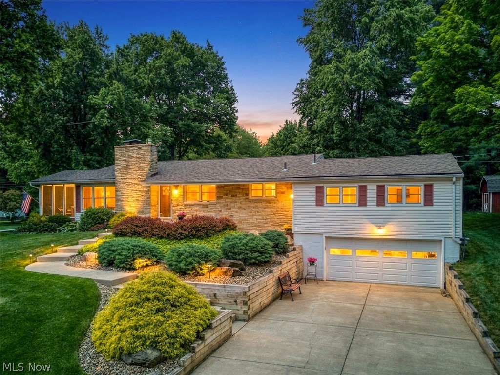 Welcome home to this beautifully updated 4-bedroom, 2.5-bath raised ranch nestled on a scenic hilltop in the desirable Twin Lakes community of Franklin Township, just north of downtown Kent. Enjoy peaceful views from the spacious back deck overlooking the large backyard, complete with a storage shed and plenty of room for outdoor activities and entertaining. A welcoming front patio provides the perfect spot to enjoy your morning coffee or unwind at the end of the day.

Inside, you'll find an abundance of natural light and thoughtfully updated living spaces, including a remodeled kitchen with appliances included, updated bathrooms, hardwood floors, replacement windows, newer roof, and updated HVAC system. The inviting living room features a cozy wood-burning fireplace, while the finished lower-level recreation room offers additional living space with a gas-log fireplace, full bath, and walkout access to the attached 2-car garage.

A screened-in side porch provides yet another space to relax and enjoy the outdoors. With multiple gathering areas both inside and out, this home is ideal for entertaining family and friends.

As an added bonus, ownership includes access to Twin Lakes amenities, including beach privileges and boat docking, allowing you to enjoy lake living all season long. Don't miss this opportunity to own a well-maintained home in one of the area's most sought-after lake communities!