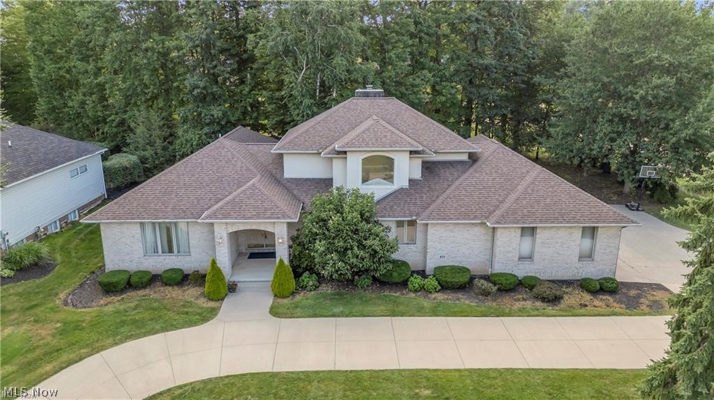 Executive all-brick Colonial in the prestigious Rosemont Ridge community offering over 5644 sq. ft. of total square
footage on a beautifully landscaped half-acre lot with a horseshoe driveway . Designed for both elegance and everyday
comfort, this home features two first-floor primary suites—ideal for multi-generational living or private guest quarters—
and a dedicated first-floor office perfect for working from home. The heart of the home is the updated chef’s kitchen,
complete with premium cabinetry, quartz countertops, stainless steel appliances, and an oversized island that anchors the
open-concept layout. The kitchen flows seamlessly into the formal dining room and expansive great room, highlighted by
a gas fireplace and walls of windows that fill the space with natural light. Upgrades include: whole-house repaint, brandnew carpet, updated master bath, newer roof, new whole-house vacuum system, and newer hot water tanks. The exterior
showcases timeless full brick construction for low maintenance and exceptional curb appeal. The second floor offers
additional spacious bedrooms, a full bath, and versatile bonus spaces. A full basement with 1,599 sq. ft. is ready for
finishing or provides abundant storage. The 3-car attached garage ensures ample parking and workshop potential.
Situated in Copley-Fairlawn School District and minutes from premier shopping, dining, and I-77 access, this home
combines luxury, functionality, and location.