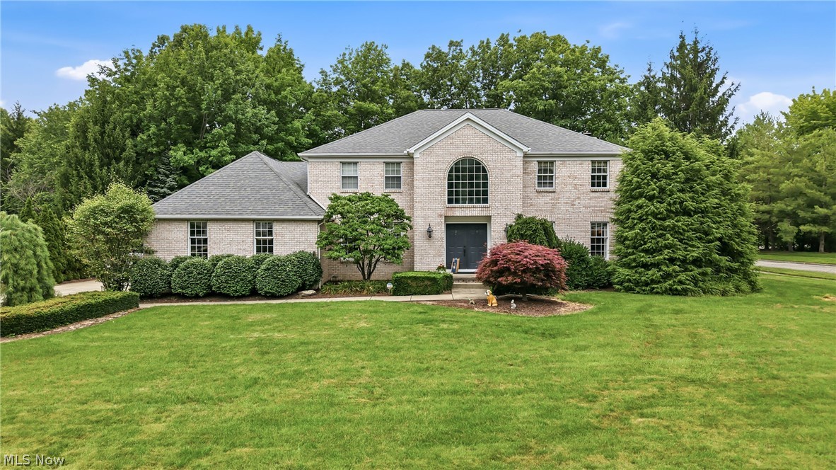 Welcome to this exceptional 5-bedroom, 2.5-bath home nestled in the sought-after Timber Run Development, offering spacious living, timeless design, and beautiful custom finishes throughout. The impressive great room is the heart of the home, floor-to-ceiling stone fireplace, expansive windows, and an inviting open-concept layout from the kitchen filled with natural light. 
The custom gourmet kitchen is a true showpiece, complete with granite countertops, a neutral tile backsplash, a center island with a gas cooktop, and brand-new stainless steel appliances. Perfect for entertaining, the kitchen flows seamlessly into the bright breakfast area and sunroom. The elegant formal dining room showcases crown molding and rich custom ceilings, while the front living room provides an additional space for relaxing or hosting guests. Upstairs, the expansive primary suite offers a large walk-in closet and a spacious ensuite featuring dual vanities. Three additional generously sized bedrooms, each with large closets, share a well-appointed full bathroom with double sinks, providing plenty of space for family and guests. The main floor includes a versatile fifth bedroom or private home office, a convenient laundry room with private exterior access, a powder room, and an oversized foyer with two coat closets for added storage. Step outside through the sliding glass doors to the beautiful sunroom, an ideal space for year-round entertaining. From there, enjoy the expansive stone patio overlooking a private, fully fenced backyard complete with a built-in fire pit, stone seating wall, and mature trees that create a peaceful, secluded setting. This remarkable home combines generous living space, quality craftsmanship, and outstanding indoor-outdoor living in one of the area's most desirable eighborhoods.