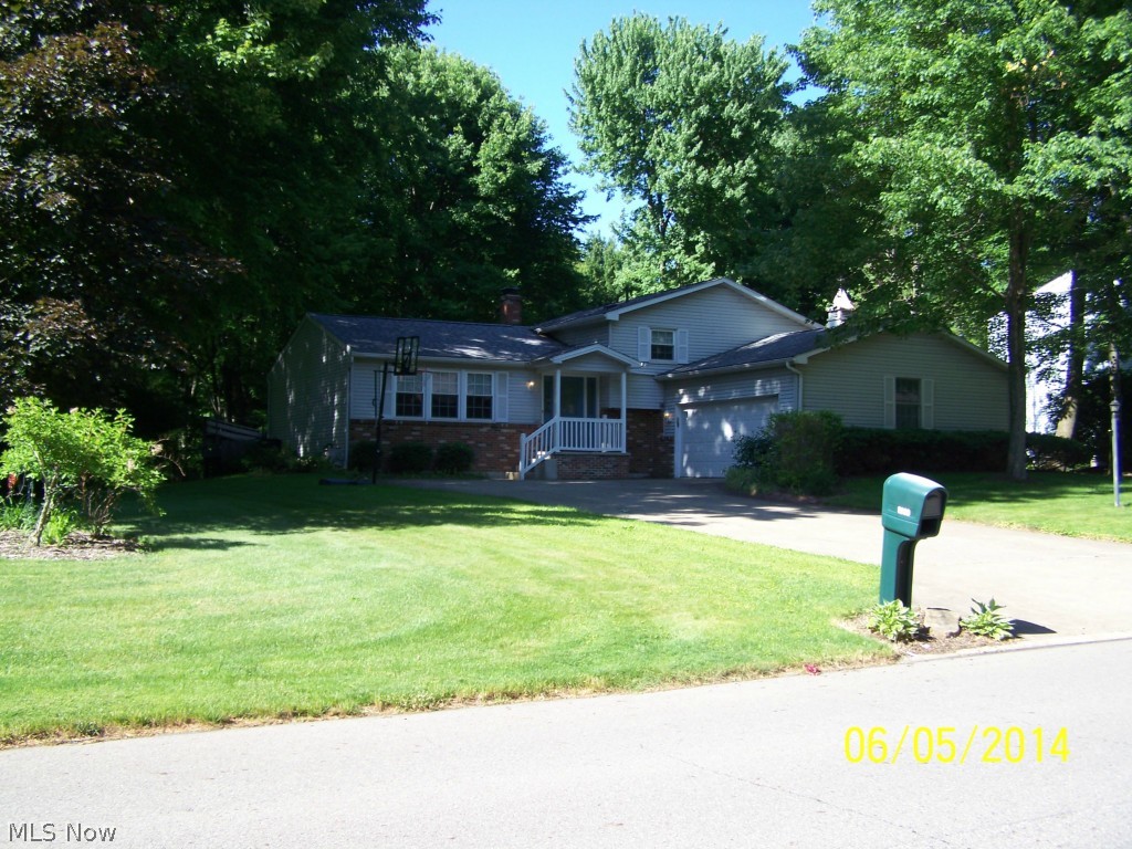This 3 bedroom split level in desirable Howland neighborhood just may be the perfect move-in ready home! Open floor plan main level is freshly painted w/newer carpet. Updated kitchen has beautiful hardwood (white oak) flooring, Kraftmaid cabinetry including large pantry & newer appliances. Huge two-tiered deck with built-in seating is off dining room & overlooks fenced & private back yard. Three bedrooms in upper level w/newer carpet, including master bedroom w/bath. Bathrooms updated w/Kraftmaid cabinetry & ceramic tile. Whole-house fan on upper level. Spacious family room in lower level (wired for wall-mount flat screen TV) with newer carpet, gas fireplace & extended room for exercise or computer. Basement has laundry room & rec room w/ping-pong table.