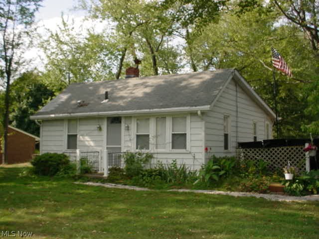 672 sq ft ranch on private 3 acres! Side deck, storage shed and partial basement! Aluminum siding, newer carpet, eat in kitchen w/range & refrigerator! Plenty of room to expand, build outbuilding or just relax in secluded back from the road quite! Mineral rights transfer to new owner, currently oil lease owner receives approx $30 every 3 months. Well & septic passed Stark County, report available.
