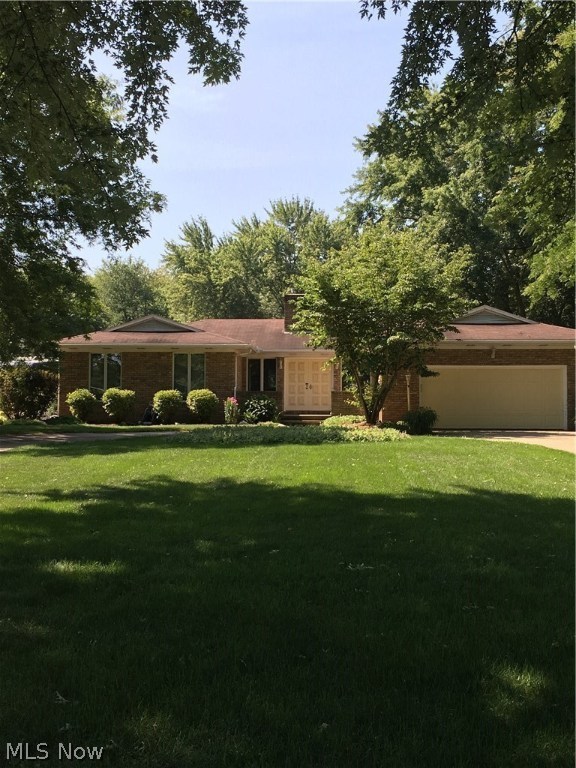New price and neutral paint March 2017. Great location - a quality home!  All brick 1692 sq. ft. ranch, 1-acre lot makes entertaining enjoyable. Convenient  welcoming horseshoe shaped all concrete drive. Hospitable living room, abundant natural sunlight with 5' windows throughout, stone WDBR fireplace (gas available).  Large back deck views professionally landscaped gardens and delightful feathered friends. You'll appreciate handiness of dining room with sliders to bright sun porch partially shaded by mature trees.  Eat-in kitchen boasts bay windows and custom built island.  Huge walk in pantry with abundant storage situated across from 1st floor laundry.  Many recent energy efficient upgrades includes newer hot water heater, furnace, central air, full water softening system with a reverse osmosis tap at kitchen sink and refrigerator.  Double-garage door opener with security keypad.  Newer appliances include oven, refrigerator and dishwasher.  The full basement has a professionally fin