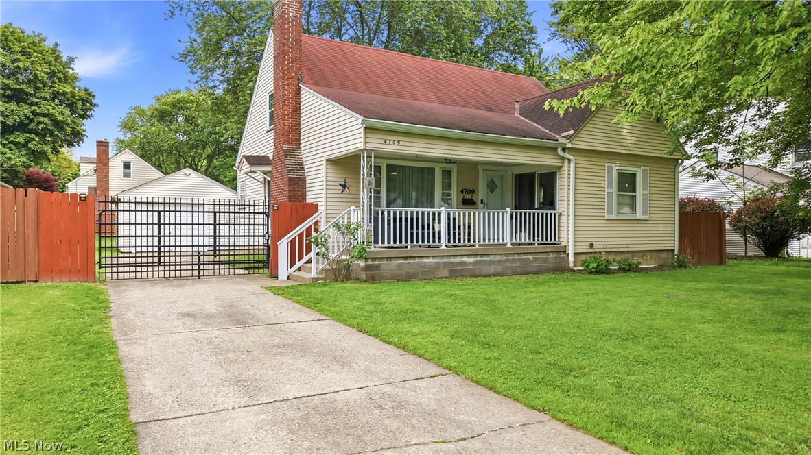 Welcome to this well-maintained Cape Cod in the Boardman School District featuring beautiful curb appeal with a manicured lawn,  and a gated driveway leading to the fully fenced backyard. The inviting covered front porch offers access through either the sliding glass door from the master bedroom or the main entrance into a warm and cozy living room filled with natural light from oversized windows and highlighted by a wood-burning fireplace.

The main floor offers two nicely sized bedrooms with an updated full bathroom conveniently situated between them. Just beyond the living room is a formal dining area that flows into the spacious kitchen featuring granite countertops, ample cabinetry, and a corner sink overlooking the backyard. Nearby access leads to the waterproofed basement offering plenty of storage and endless possibilities for future finished living space, recreation, or a home gym.

Upstairs, the entire second floor serves as a generously sized third bedroom with an open layout and additional space perfect for a reading nook, office area, or sitting space overlooking the front yard. Step outside to enjoy the fully fenced backyard ideal for privacy, entertaining, or furry family members, along with an oversized one-car garage for added convenience. This charming home offers comfort, character, and functionality in a desirable central location close to shopping, dining, and everyday amenities.