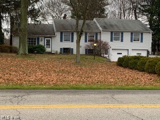 Do not let this one pass you by!  This one has plenty of space including a potential in-law suite with a kitchen!  Large lot with a partially fenced in yard.  Two car attached garage as well as shed for storage.  Eat in kitchen, living room w/ a fireplace, family room w/ a fireplace, half bath and laundry room on the first floor.  Located above the 2 car garage is an additional living suite with a kitchenette, living area, a bedroom, full bath and an enclosed porch. This area can be accessed directly from the outside or from the home. Call today.  This one is priced to move.
