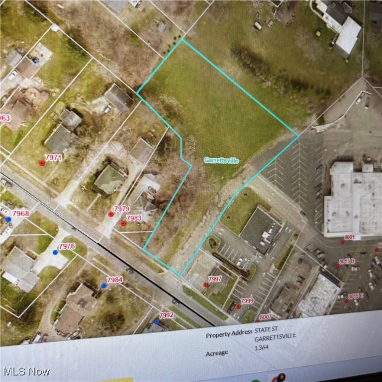 High and dry 1.3 acreage overlooking the Beautiful Village of Garrettsville. All utilities are available. The Village of Garrettsville has an easement over part of the street going back to the Fire Hydrant. This is an LSHAPED lot. Would make a lovely lot for the home of your dreams. Zoned Commercial.   Zoning would need to be changed to make it residential.
Perfect for a Big Box store. Our community would support a Large entity such as Walgreens, a phone store, a computer store like Staples.  Who would like to be the next Big builder in our community?