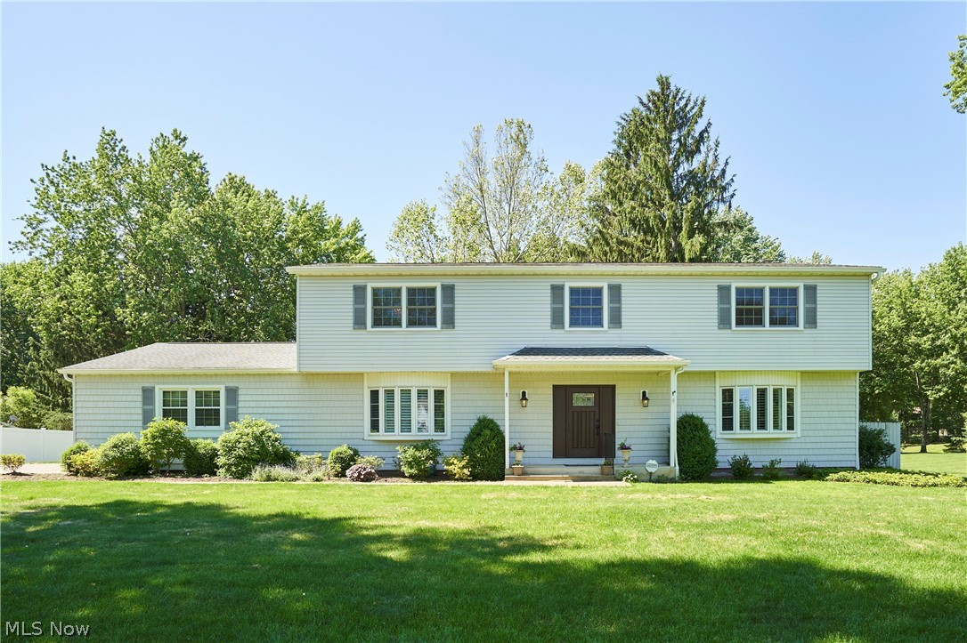 Discover this meticulously updated 5-bedroom colonial in the highly sought-after Hunter Hills allotment of Bath. Situated on a breathtaking 2.75-acre lot in the top-rated Revere School District, this home blends timeless elegance with modern efficiency. The main level features stunning teak flooring, crown molding, and a formal dining room with dual chandeliers. The remodeled kitchen is a chef’s dream, boasting maple cabinetry, granite countertops, and expansive pantry storage. Relax in the family room by the wood-burning fireplace, or step through the Pella slider onto your private Trex deck with a pergola overlooking the lush grounds. The primary suite offers a luxurious remodeled bath and a spacious 12x9 walk-in closet. Recent high-end upgrades include a newer roof (2016), backup generator, waterproofed basement, Pella and Andersen windows, and updated systems including a water softener and filtration. Conveniently located near shopping, highways, and the Cuyahoga Valley National Park, this home is truly move-in 
*   Spacious Layout: 5 bedrooms, finished lower level with rec room, and ample storage.
*   Premium Updates: Newer roof, siding, kitchen, master bath, and Pella/Andersen windows.
*   Outdoor Living: Expansive 2.75-acre lot with a large Trex deck and pergola.
*   Modern Efficiency: Backup generator, waterproofed basement, water softener, and advanced filtration system.
*   Prime Location: Located in the desirable Revere School District, minutes from CVNP and major highway access.