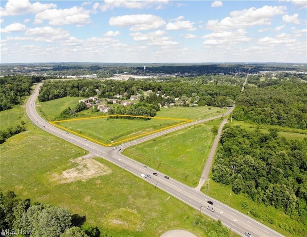 7.78 acres of Commercial development land located at the intersection of Military Road and Northpointe Drive in Zanesville.  Topography is rolling/sloped. All public utilities are available, buyer is responsible for an extensions and taps. Property has a shared access point from Military Road with adjoining parcel. Subject to reciprocal access easement agreement.
