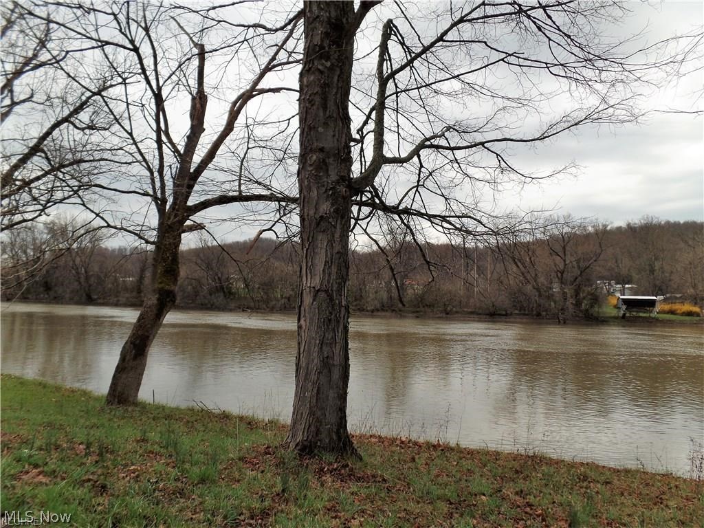 15.193 acres of wooded property with the Muskingum River. High speed internet is available and minerals are included in the sale. All cabins/mobile homes on the property are owned by the tenants and are not part of the sale. Buyer may elect to continue rental or terminate agreement, which are all month to month tenancy. A must see! Additional land for sale see MLS# 3916842 & 3916558, seller willing to sell all as one. DO NOT CONTACT TENANTS OR GO TO TENANTS HOMES.
The property currently has tenants on the bottom land, who own the residences and have been there for multiple years.. These Leases are month to month so there is flexibility regarding them. Depending on the wishes of the buyer, NFI can either assign the Leases to the buyer or work out an agreement with the buyer as to how they will be handled.