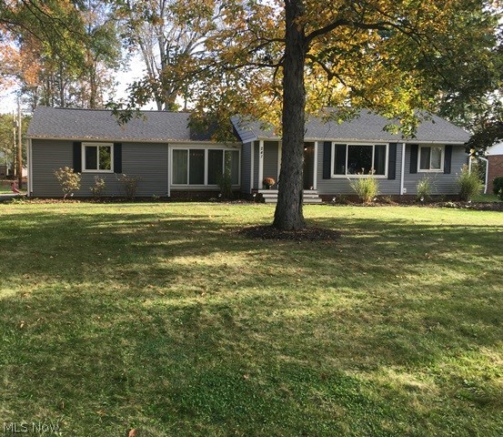 Affordable and beautiful ranch in Hudson.  Totally updated with wood floors, kitchen, bathroom, etc.  Totally open floor plan.  The beautiful stone fireplace in the living room has gas logs controlled by remote.  The siding, roof, windows, furnace, and hot water tank are all newer in the past several years.  The views of the backyard are beautiful.  
All appliances stay.
Move right in and enjoy this home with nothing to do.