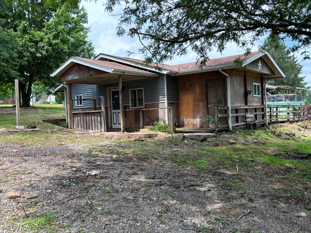 Bring your remodeling ideas and vision to restore this country ranch to its full potential! This 2-bedroom, 1-bath home offers a functional layout featuring an eat-in kitchen, spacious living room, and convenient main-floor laundry. Situated on nearly one acre in a peaceful country setting, the property provides plenty of room to expand, garden, or simply enjoy the outdoors. With some TLC and updates, this home presents an excellent opportunity to create the country retreat you've been dreaming of.