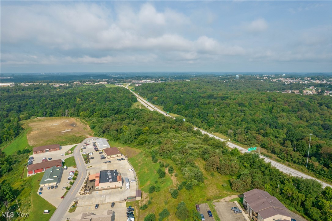 Approximately 15 acres of residential development land in Weirton with public water and sewer available. Property is suitable for a single-family subdivision and has prior planning history indicating potential for up to approximately 55 homes, subject to municipal approvals. Conventional subdivision yield estimated at ~45 homes, with density upside through a Planned Unit Development (PUD) or cluster approach. Excellent opportunity for builders seeking small-lot residential development with utility access and a clear entitlement path. Buyer to verify zoning, utilities, and approvals.