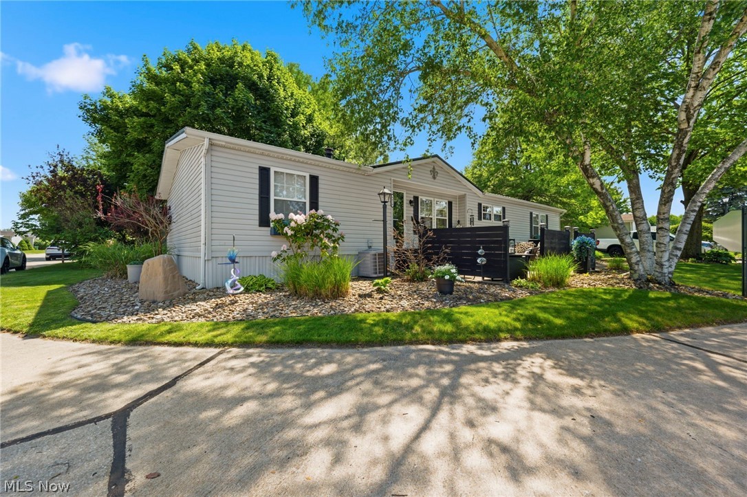 Welcome home to this beautifully updated 3-bedroom, 2-bath manufactured home in Madison Township! Thoughtfully renovated throughout, this move-in-ready home offers an inviting open-concept layout that's perfect for both everyday living and entertaining.

The spacious primary suite features a private en-suite bathroom complete with a large soaking tub, creating the perfect place to unwind at the end of the day. Two additional bedrooms and a second full bath provide plenty of space for family, guests, or a home office.

Recent updates throughout the home give it a fresh, modern feel, while the newer metal roof offers added peace of mind. You'll also appreciate the abundance of storage space, making it easy to stay organized.

Step outside to enjoy the large private patio—ideal for relaxing, grilling, or entertaining—and take advantage of the storage shed for your outdoor tools and equipment. The paved parking area provides convenient off-street parking, and the corner lot offers additional space and privacy.

Conveniently located near shopping, dining, parks, and major roadways, this affordable, move-in-ready home is a fantastic opportunity for first-time buyers, downsizers, or anyone looking for low-maintenance living. Schedule your private showing today! One year home  warranty offered from APHW!