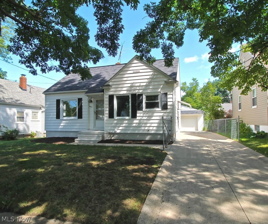 Very Clean, super cute two bedroom Cape with walk up attic space for additional bedroom or extra room.  This lovely home has been freshly painted, and the original wood floors refinished to their natural beauty.  Updated kitchen with gorgeous ceramic flooring going into the dining room.  Family and dining rooms as well as the master bedroom  and second bedroom have those beautiful wood floors.  Very nice 1 1/2 car garage with extra storage! Fenced back yard with room for your pets or kiddos to play. Full basement with laundry room, glassblock windows, and utility sink, could be easily finished for added space, play area; office or entertainment area! This house is just waiting for you to move in to add your own special touches or it would be a great rental!  Way too nice to pass up!  This won't last long!