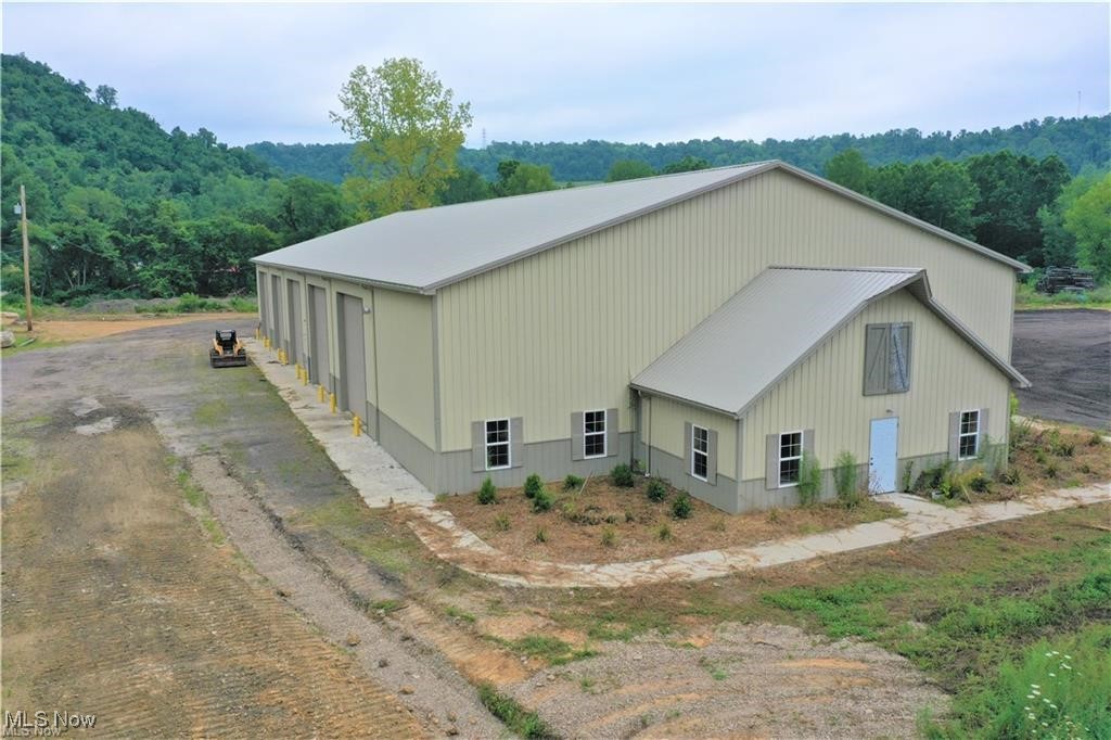 Welcome to the thriving industrial park located just minutes away State Route 7. This prime location ensures swift connectivity, allowing your business to seamlessly connect with key transportation routes. Discover a diverse range of building options tailored to suit your specific needs, ranging from 6,000 sq ft to 12,000. Whether you're a startup looking for a compact yet functional space or an established enterprise seeking room to expand, we have the ideal solution for you. Each building within this industrial park boasts 14 ft bay doors, providing easy access for loading and unloading of goods. The high ceilings not only facilitate efficient storage solutions but also offer the flexibility to accommodate various industrial operations. With ample office space included, you'll find the perfect balance between administrative functionality and productive workspace. For businesses that require additional outdoor storage or operational area, an optional laydown yard is available to meet your unique demands. This feature ensures that your operational needs are met without compromise. Pricing is tailored to the square footage of the chosen building and any additional space requirements you may have, such as the optional laydown yard. We encourage you to call now to schedule a tour. Elevate your operations in a strategically positioned industrial park that marries accessibility, functionality, and customization. Contact us today!