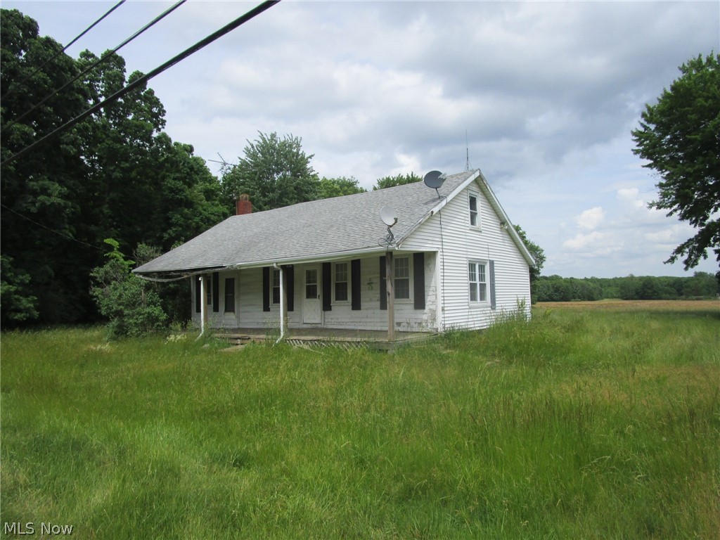 Bring your tools and a vision - this one is ready for a glow-up! Located just 1/2 mile North of the Hartsgrove Circle, this 1614 square foot farm house is ready to move on to its next chapter. Definitely lots of work, but a fantastic location with easy access to Route 6 and a straight shot north to I-90. Buyers are advised to do their due diligence, but this property MIGHT be zoned for commercial use! Slow down and enjoy the pace of this rural farming community. Enjoy gorgeous sunrises in the morning and lovely sunsets at night - and there's enough room on the 3 acres to add an outbuilding, garage, barn - just the right size for your move to the country. Please bring a flashlight to view - no power is on and use extreme caution when you head down to the basement. (Be careful of the threshold board.) Cash or renovation loans would be the key here !