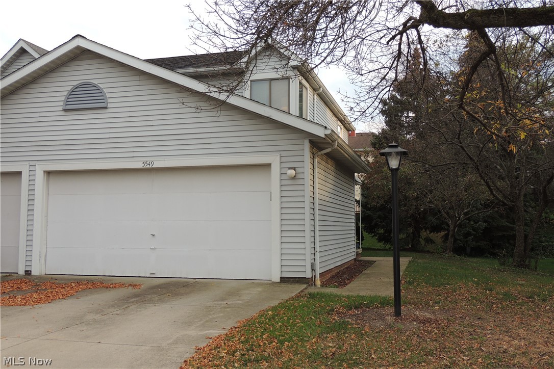 Located in the highly desired SANDPIPER subdivision, this 2 bedroom, 2 bath, is an "end unit" with in-suite laundry & a 2 car attached garage! Foyer entry, half bath, and the garage access greet you upon entry. You'll love the updated vinyl flooring on the 1st level. The kitchen has oak cabinetry, neutral countertops, a pantry, breakfast bar with 2 bar stools, & the refrigerator, stove & dishwasher stay! The living room is light & bright, with wall-to-wall carpeting & a sliding patio door that leads to an attached wooden deck w/ privacy walls. On the 2nd level, a master bedroom fit is for a "king", an updated full bath & Bedroom #2 is spacious with wall-to-wall carpeting & a large space! The lower level/basement is partially finished with a laundry room (washer & dryer stay), the mechanics for the home & a rec room with unlimited potential for a home theater, billiards, bar or game room ~ let your imagination go! The SANDPIPER subdivision has a pool, clubhouse, tennis courts & playgrou