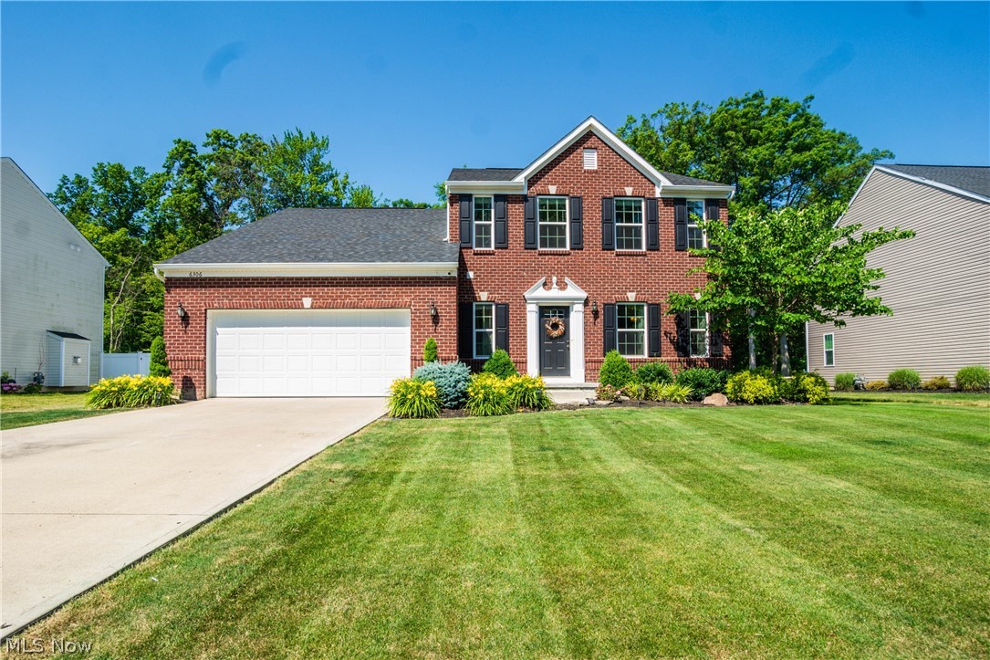 Why Build!? Remarkable opportunity to live in this nearly new home in the Estate section of highly sought after Deerfield Estates. The moment you step through the front door, past the full brick front, you will know this is the one! This home was built with no expense spared and nearly every builder option added. Real wood flooring, extends though the foyer, half bath, hallway, kitchen and morning room. Private 1st floor office, with beveled glass french doors, is located directly off the great room. Great room features stone, gas fireplace and over looks the wooded back yard. The unbelievable kitchen is complete with granite countertops, stainless steel appliances, gourmet center island with seating, recessed lighting, and natural stone tile back-splash. Huge morning room off the kitchen, gives you that open concept lay out that you are looking for. The large sliding glass doors off the morning room lead to the custom rear deck with pergola, over looking the woods out back. The large