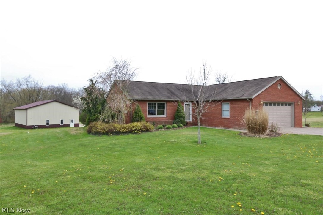 Beautiful Brick ranch , 3 bedrooms with Master bath another full bathroom the 1st. floor , with large multi level deck that flows into a concrete patio with basketball hoop , completely finished basement with Walkout to the concrete patio , wit a 2 car attached garage and 1st floor laundry. The 48 x 40 commercial  pole building has 1920 sq. ft. on the main level additional 400 sq. ft on the upper level and 2 large commercial garage doors great opportunity for a business . New AC unit