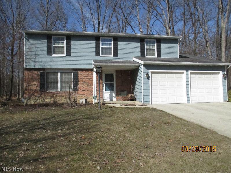 Welcome Home to this warm and Inviting 4 Bdrm, 2.5 Bath Family Home that sits on a Wooded .63 Acre Lot, whose Private Rear Yard (Perfect for Puppies) backs up to the Metro Parks and features a Large Deck and Shed.  The First Floor of the Home has recently been totally remodeled with a Living Room with Hardwood Flooring, a Large Eat-in Kitchen with hardwood flooring, New Countertops and Appliances, loads of Wood cabinetry, a Family Room with Fireplace, New Carpeting and Sliders to that walk out to the private Deck, as well as a totally remodeled Powder Room. The Second floor features a Master Suite with large bedroom for Mom & Dad, Master Bath and Huge Dressing Area, 3 additional bedrooms for the Kids or Office Space and another Full Bath. The Spacious Basement is imminently Finishable and has been recently water-proofed and the walls re-enforced with one wall completely replaced-the water-proofing is warrantied and Warranty is transferable. The Bsmtt also features a Brand new Furnace,