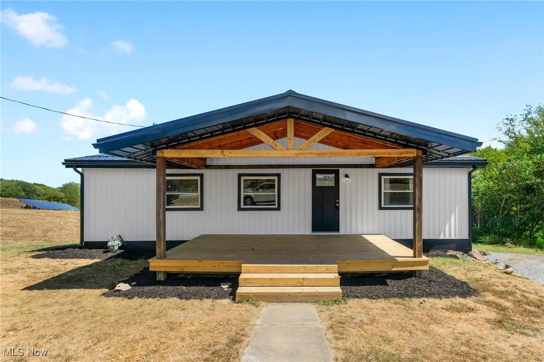 This home is just outside city limits and offers the peace & quiet of country living! Enter into this beautifully updated home where everything is brand new—from top to bottom, inside and out. This move-in-ready property offers a perfect blend of modern comfort and timeless charm. Enjoy an amazing open-concept kitchen that’s been completely redesigned with beautiful cabinets, countertops, and new stainless steel appliances. Relax or entertain outdoors with not one, but two expansive porches. The huge covered front porch offers classic curb appeal and a welcoming space to unwind, while the spacious covered back porch provides incredible views and total privacy, creating your own personal retreat. The basement has over 500 sq ft of additional living space that has been finished with a full walkout. Every detail has been thoughtfully upgraded—new systems, finishes, fixtures, flooring, paint, and more—offering peace of mind and low maintenance for years to come. This is truly a turn-key home that checks every box. Don’t miss your chance to own this stunning, fully renovated gem!